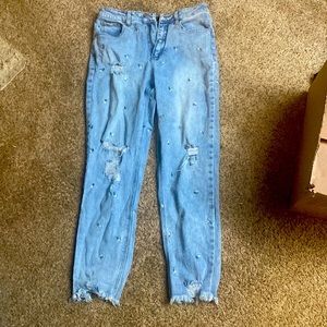 selling junior jeans size 7 ripped with flowers on it also ripped at bottom
